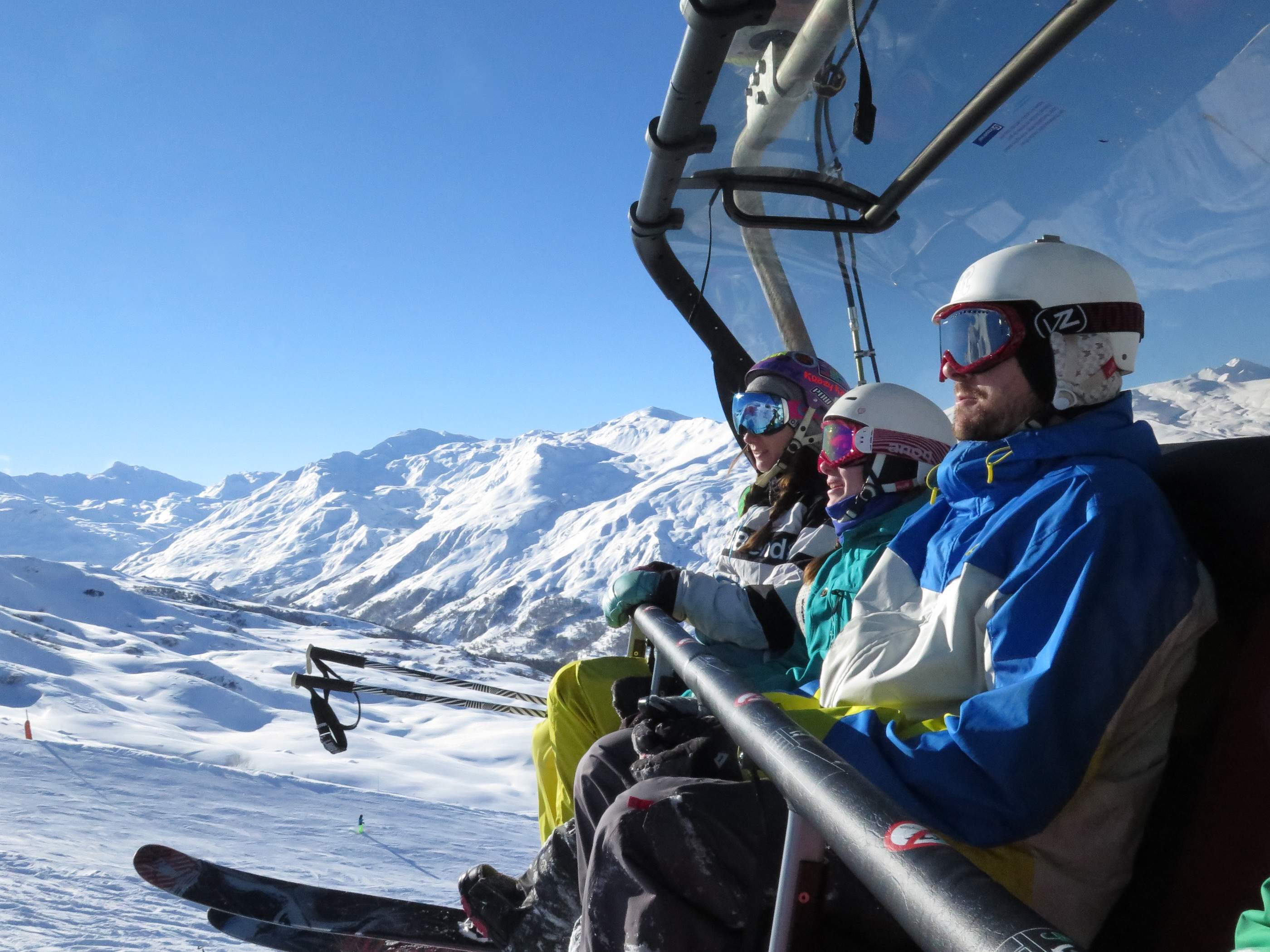 Family on a chairlift during a short break ski holiday